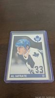 Front of Al Iafrate rookie hockey card showing player image in Toronto Maple Leafs uniform, blue leaf rookie logo, and number 33.