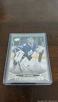 Front of Ben Scrivens YoungGuns rookie hockey card in protective sleeve showing player action photo and team name Toronto Maple Leafs.
