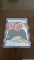 Front of the Connor McDavid hockey card showing the player in Oilers jersey with Canadian flag background.