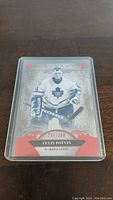 Front of Felix Potvin hockey card short print 234/399 showing player in Maple Leafs goalie gear with decorative elements and numbering