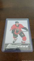 Front of Fredrik Claesson YoungGuns rookie hockey card showing the player in Ottawa Senators uniform skating with stick.