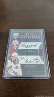 Front view of the dual autographed hockey card featuring image and signatures of Ilya Bryzgalov and Mikkel Boedker.