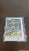 Front of Kevin Lowe rookie hockey card showing player image, Oilers logo, and card details.