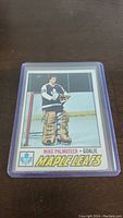Front of Mike Palmateer rookie hockey card showing player image in goalie gear with Maple Leafs branding.