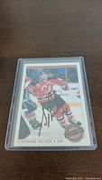 Front of the Stephane Richer hockey card with autograph, showing player in red New Jersey Devils uniform.