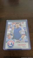 Front of baseball card showing Tom Brady in catcher gear with Montreal Expos logo.