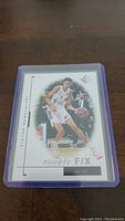 Front of Victor Wembanyama rookie basketball card featuring player image, Rookie Fix branding, and card number 21/25.