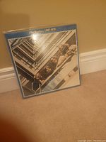 Photo of The Beatles 1967-1970 vinyl record album cover showing the band members in a building stairwell.
