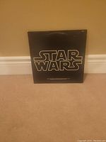 Front cover of the Star Wars album showing the logo against a black background