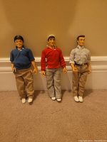 Photo of three vintage dolls representing Skipper, Gilligan, and The Professor from Gilligan's Island.