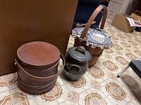 Photo of all three items - pottery urn, wooden firkin bucket, and apple basket with lid.