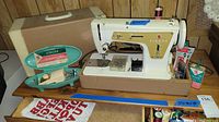 Singer Model 237 sewing machine with hard case and accessory case including buttonholer, needles, empty oil can