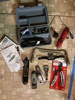 Overview photo of all the tools included, including Skil rotary tool, hand planes, saw frame, spoke shave, Craftsman wrench set in packaging, and assorted hand tools.