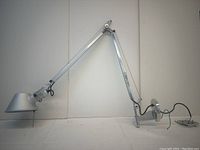 Full view of lamp fully extended on white backdrop