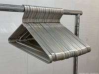 Angled view of entire set of 19 hangers on rack