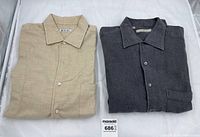 Both shirts folded side by side showing beige Loro Piana on left and charcoal Zegna on right.