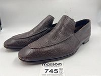 Pair of loafers angled to show shape and color