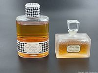 Frontal view of two bottles side by side showing overall appearance and fill levels