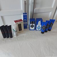 Full lot photo showing all items in lot including Jack Black products and Proraso shaving foam, Cremo Beard Comb on white background.