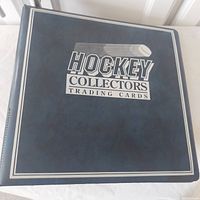 Black three-ring binder cover labeled “Hockey Collectors Trading Cards”
