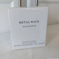 Front of box showing Metal Wave Allsaints branding, weight and description.