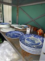 Collector plates, cream and sugar set, wooden dominos on metal shelf