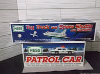 Photo of 1999 Toy Truck and Space Shuttle box with satellite included, showing product details and branding