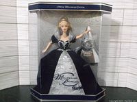 Barbie doll in original packaging with display stand and Millennium Keepsake ornament visible