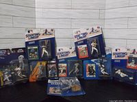 Full view of all 8 Starting Lineup figurines still in original packaging, minor box wear visible.