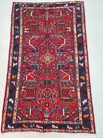 Full front view of rug showing overall geometric pattern and border