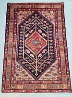 Full front view of rug showing overall design and condition