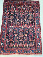 Full view of rug face showing all-over pattern and overall condition.