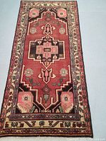 Full view of rug laid flat, showing overall pattern and color palette