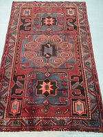 Full view of rug face showing geometric central medallion and border design