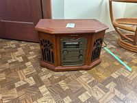 Front and side views of Memorex 9290OMMO stereo combo showing wooden cabinet with speakers and control panel.