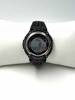 Front view of Casio SGW-200 watch digital display showing lap and distance measurement. Black resin strap and silver bezel visible.