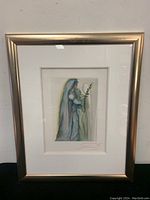 Full front view of framed print showing image, mat and frame