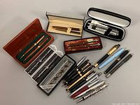 Full view of all pens and mechanical pencils with boxes, showing variety and condition.