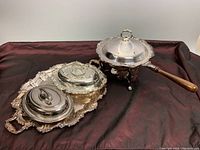 Full lot view showing the serving tray with two covered chafing dishes on a burgundy cloth background.