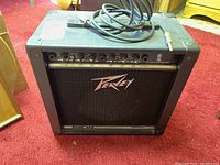 Front view of Peavey Rage 158 guitar amplifier showing brand logo and control knobs.