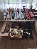 Multiple HO scale CP Rail rolling stock displayed on white table