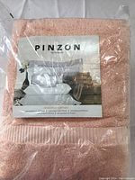 Packaged set of Pinzon bath towels with branding and product image visible on label.