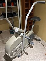 Full view of the Vitamaster exercise bike showing seat, handlebars, pedals, and main body.