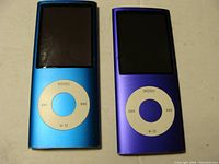 Front view of two Apple iPod Nano MP3 players, blue and purple, showing screens and click wheels.