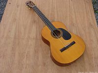 Front angle view of Goya classical guitar showing body, neck, and strings.