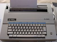 Front view of Smith Corona XL1500 electric typewriter showing keyboard, logo, and model name.