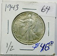 Front obverse side of 1943 Walking Liberty Half Dollar in cardboard holder indicating grade '64' and price.