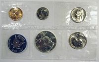 Five coins sealed in transparent packaging showing front (obverse) sides of each coin in a single row.