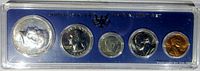 Full view of 1966 US Special Mint Set of 5 coins in original blue hard plastic holder.
