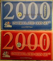 Blue and red official envelopes from the United States Mint for 2000 uncirculated coin sets, marking Philadelphia and Denver mint coins respectively.